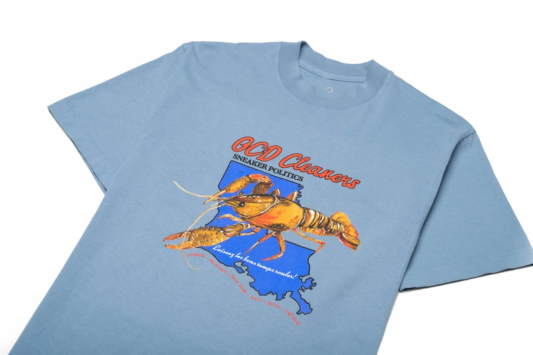 Sneaker Politics Latest Politics X OCD Cleaners Crawfish Tee - Powder Blue 2 Sneaker Politics Latest Politics X OCD Cleaners Crawfish Tee - Powder Blue